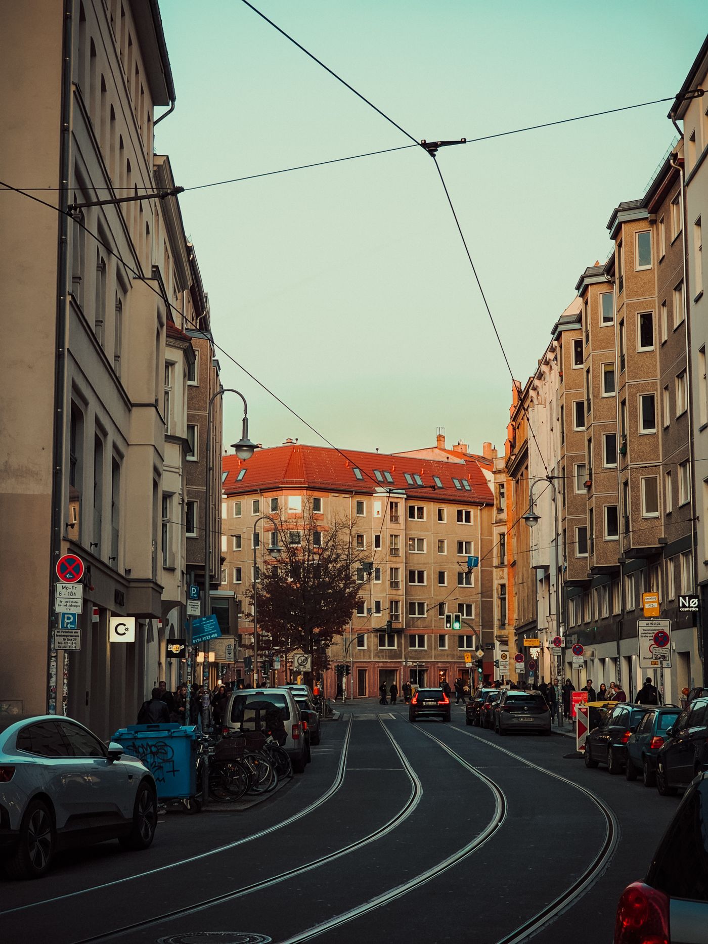 Berlin street with tram lines at dusk
